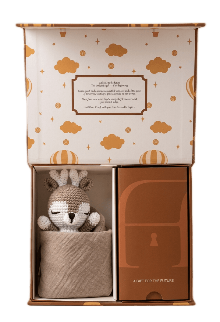 A gift box with a crocheted toy and cryptocurrency
